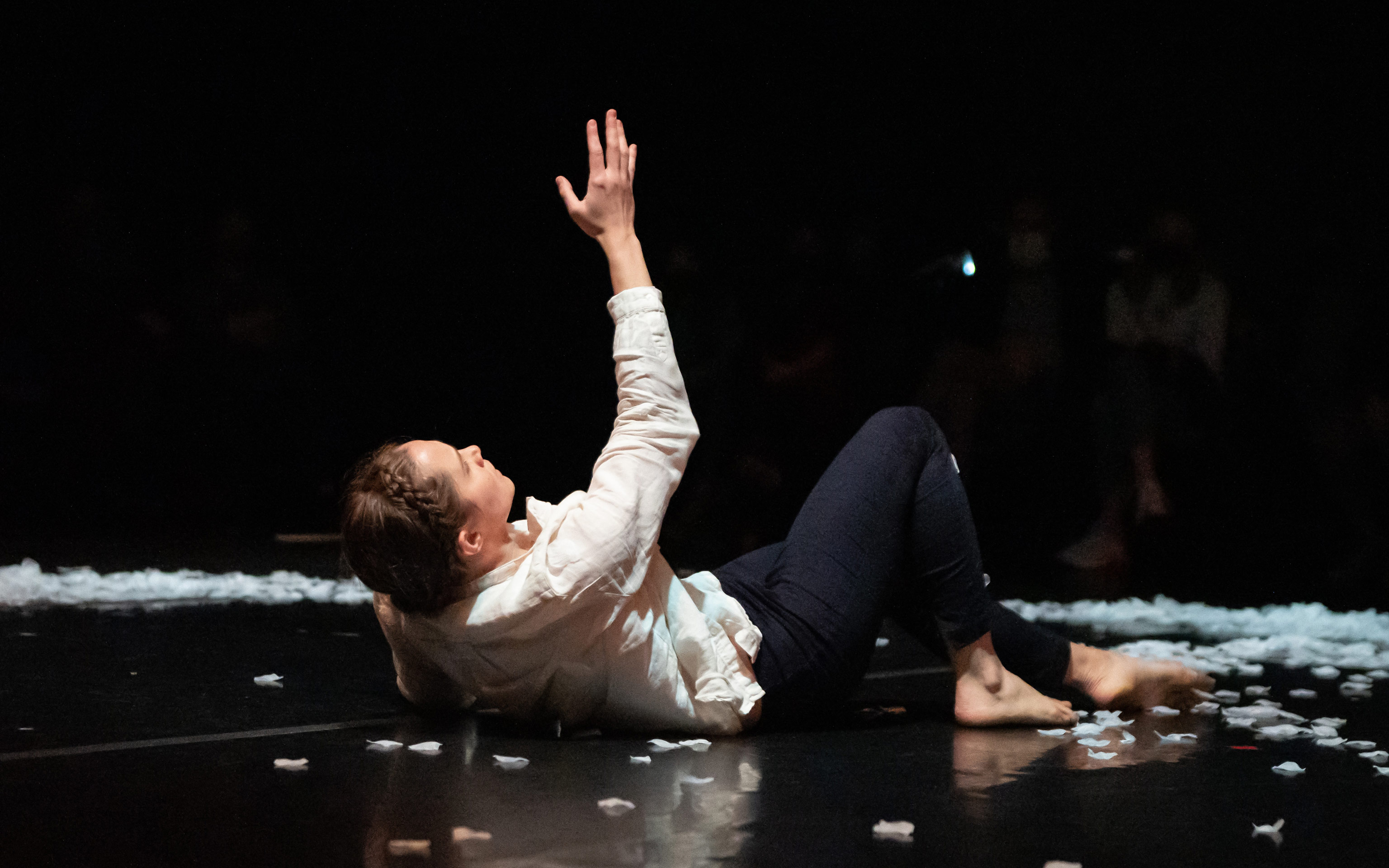 push/FOLD dancer Holly Shaw reaches up while performing at Union PDX - Festival:21 at the Hampton Opera Center in Portland, Oregon | Photography: Jingzi Zhao