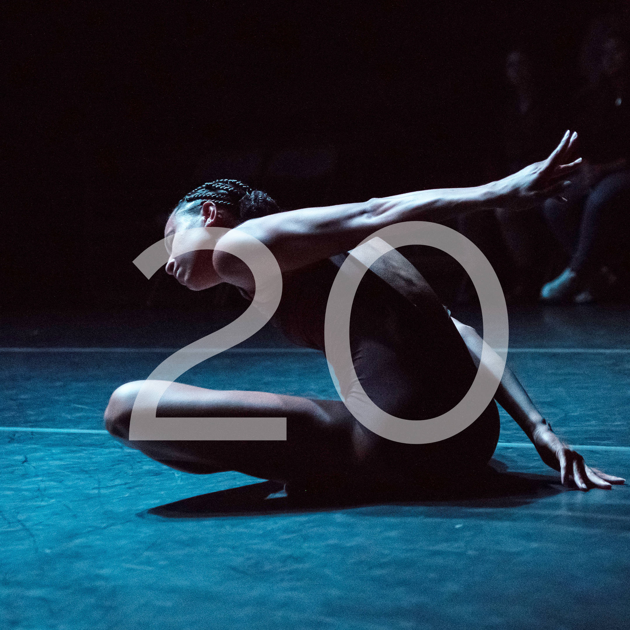 push/FOLD Dancer Ashely Morton performing her solo in the world premiere 'Ash' from Union PDX - Festival:19 at the Hampton Opera Center in Portland, Oregon. The number 20 overlays the image to indicate the Festival:20 year. | Photography: Jingzi Zhao