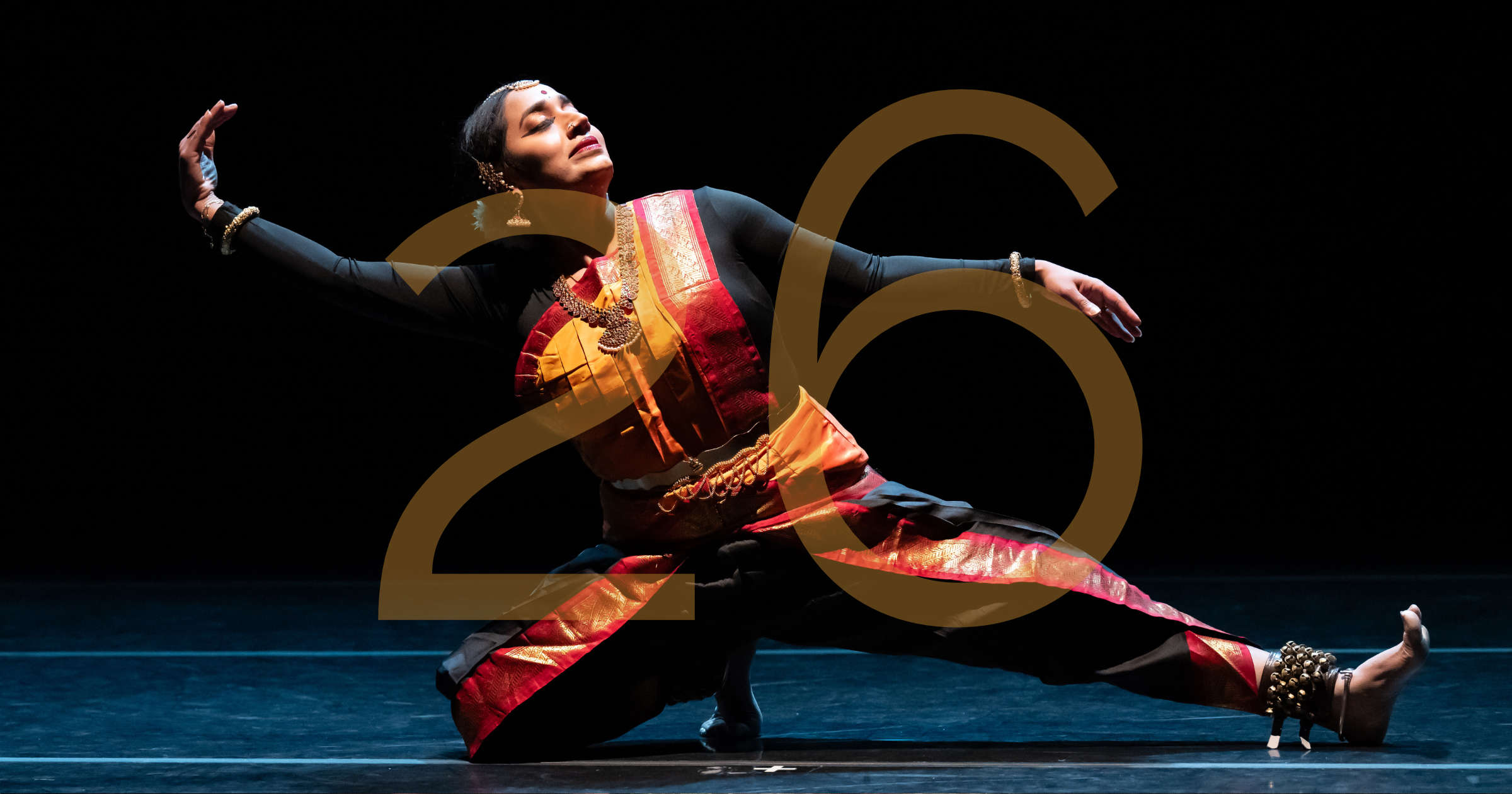 Union PDX - Festival:23 artist Sridharini Sridharan performing her solo 'Clarion Call' at the Hampton Opera Center in Portland, Oregon. The number 26 overlays the image to indicate the festival year. | Photography: Jingzi Zhao